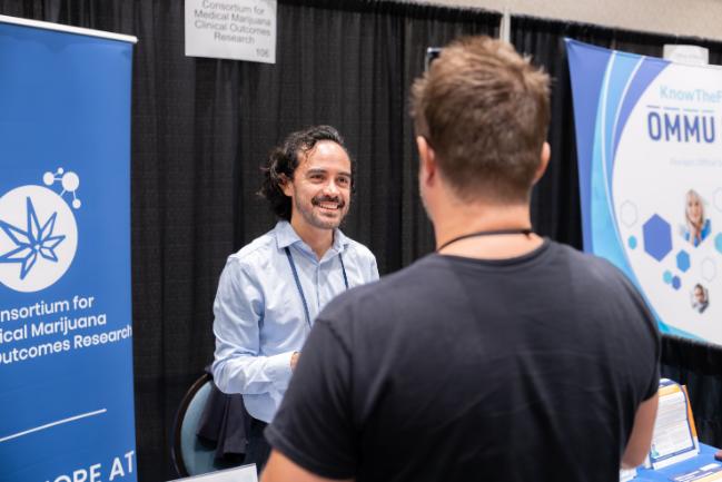 Consortium student Juan Lopez hosts a booth at FMCCE.
