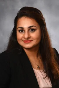 A headshot of Naueen Chaudhry