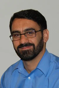 A headshot of Hassan Azari